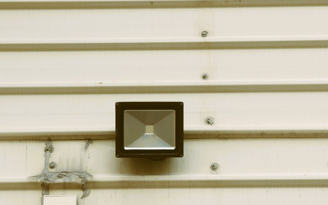 Industrial CCTV security camera installed on an industrial building, illustrating rugged surveillance requirements for factories
