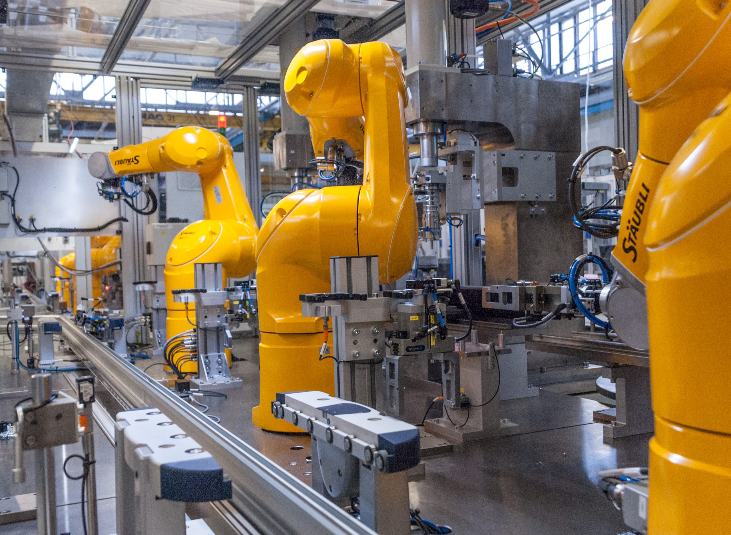 Industrial robots on an automated manufacturing line illustrating smart factory automation and industrial AI