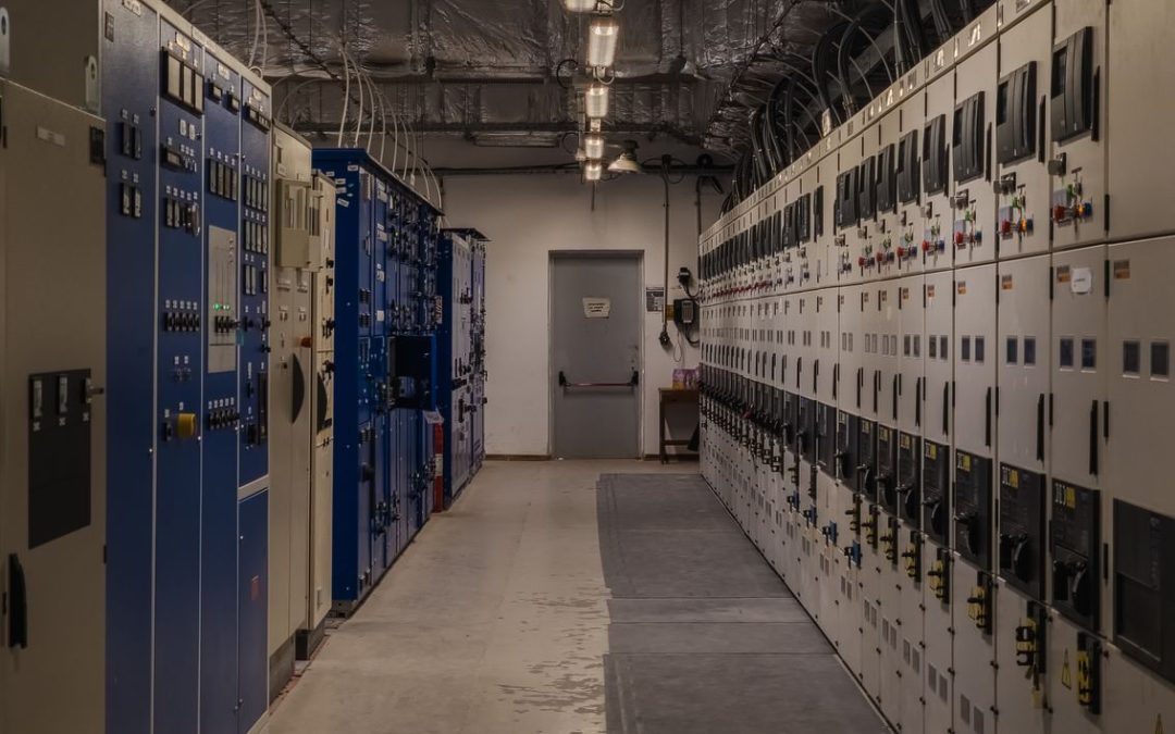 Industrial control room with electrical panels representing brownfield SCADA, OPC UA and edge data integration