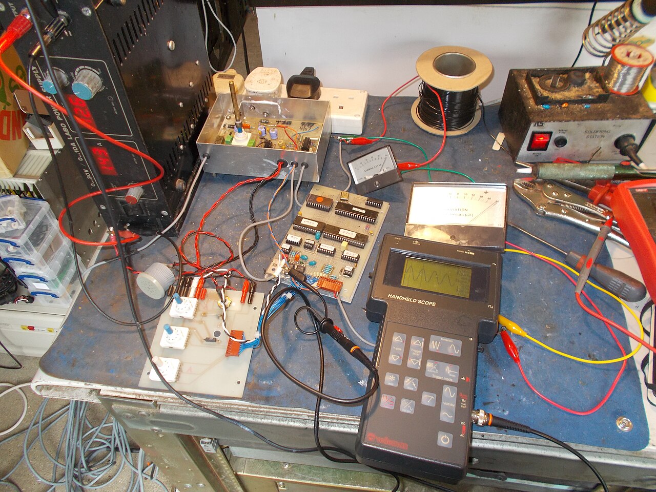 Electronics engineering bench with test equipment; photo by tony_duell, CC BY 2.0; illustrative, not affected PCAN hardware