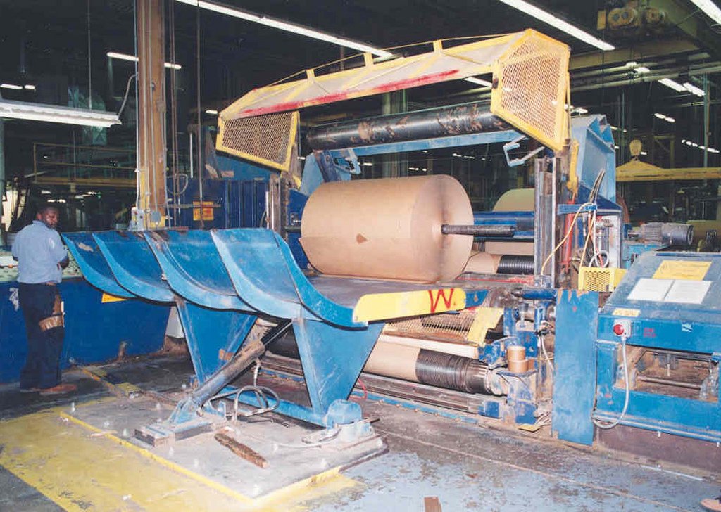 Large industrial paper cutting machine photographed by NIOSH in 2003, illustrative only; not the Bentong incident
